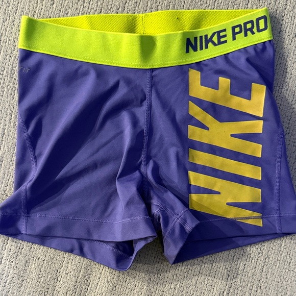 Women’s Nike Pro Purple Shorts with Yellow Band - Picture 1 of 7